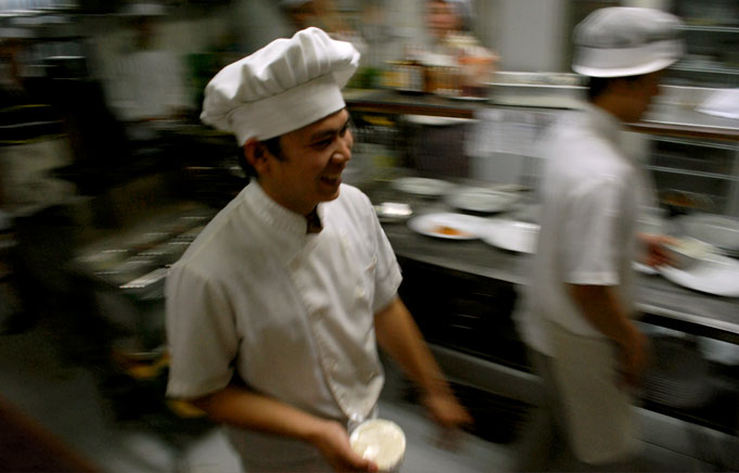 Ativity in the kitchen. Smiling but very serious